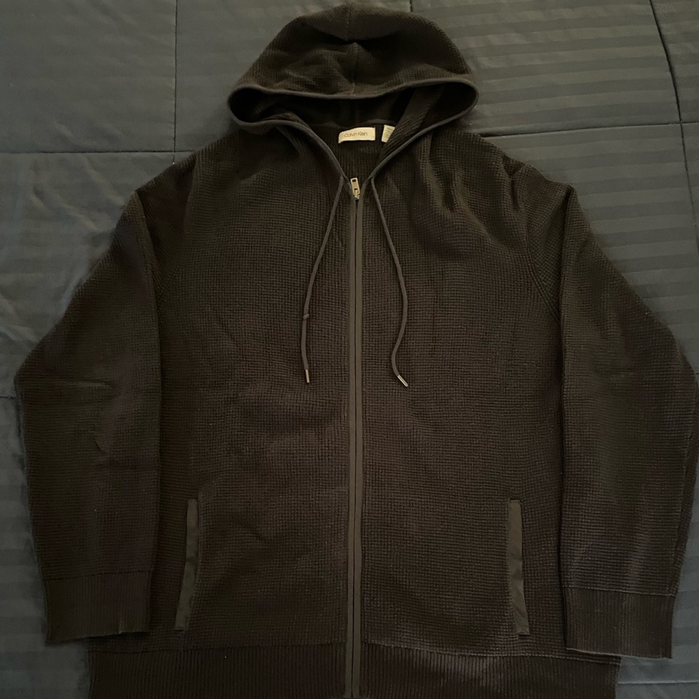 Calvin Klein Navy blue cotton hoodie with navy blue nylon lining on pockets.
